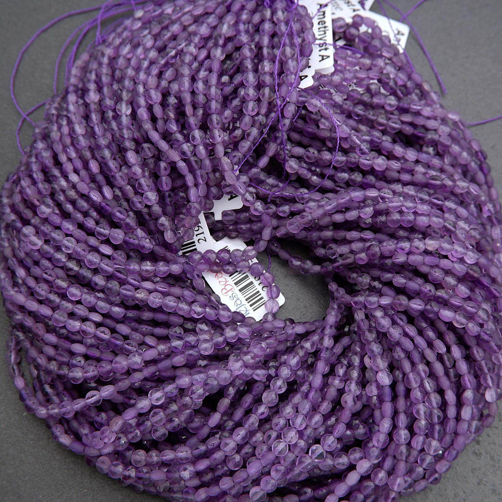 Purple faceted coin shape beads.