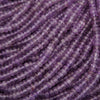 Close-up of purple beads on a string