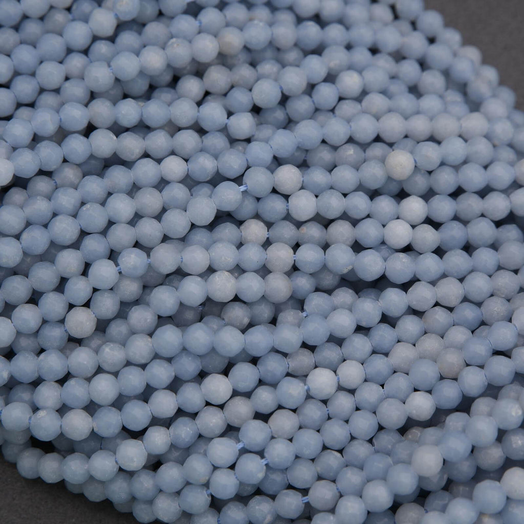Close-up of a pile of light blue spherical beads.