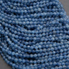 Close-up of blue beads on a gray background