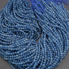 Close-up of blue beads on a gray background
