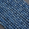 Close-up of blue beads on a dark surface