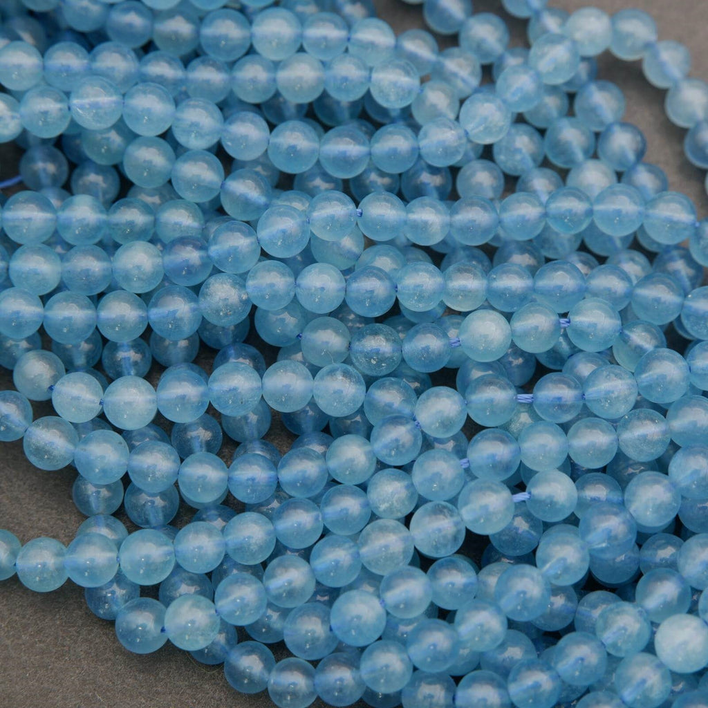 Close-up of blue beads on a dark background