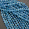 Close-up of blue beads on a gray surface