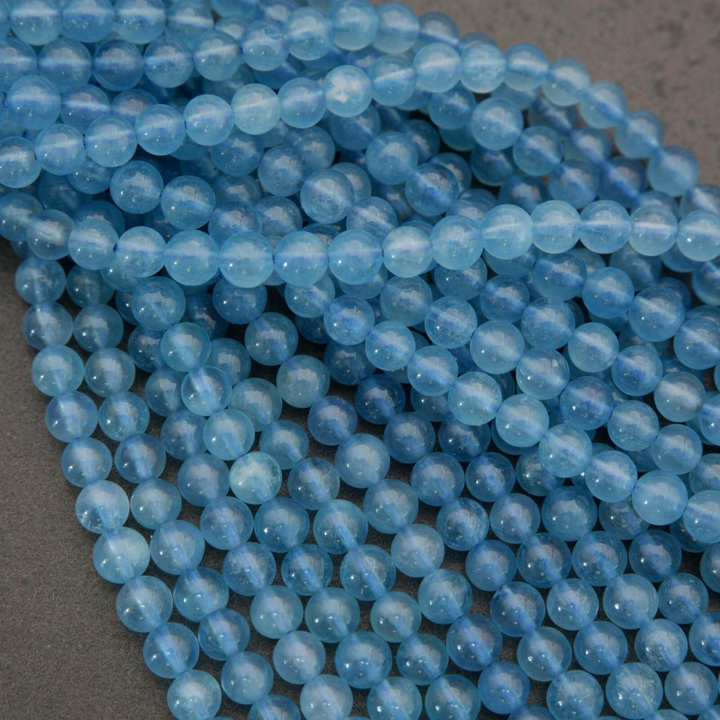 Close-up of blue beads on a gray surface