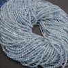 Close-up of a skein of light blue yarn on a dark surface