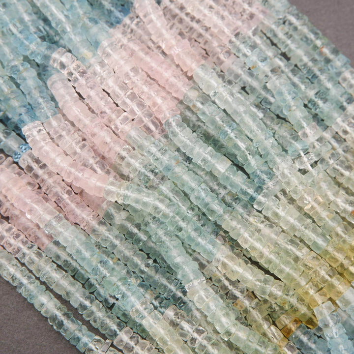 Close-up of multicolored beryl beads arranged in a pattern.