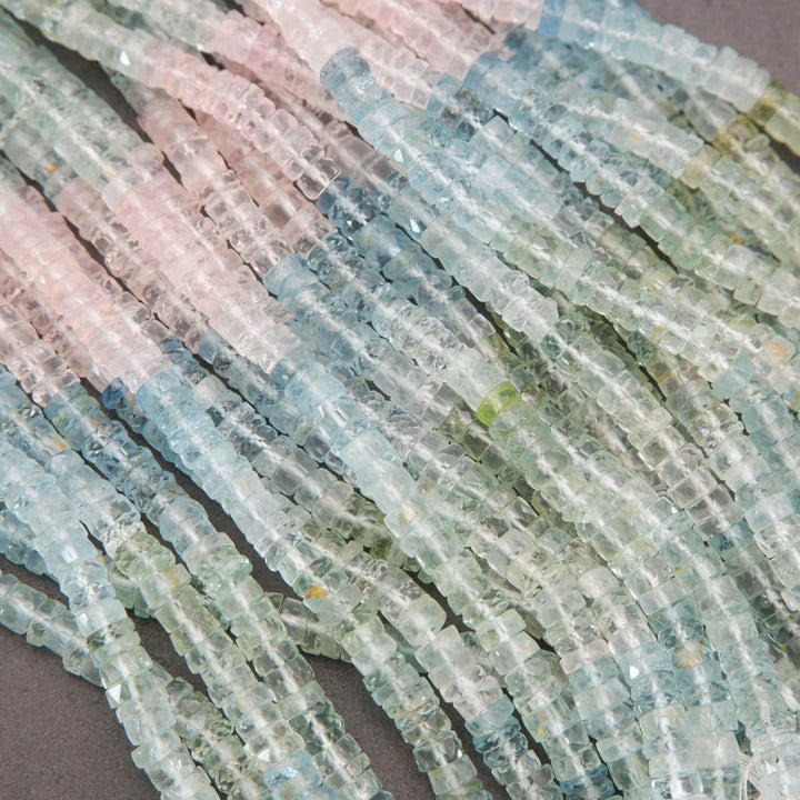 Close-up of multicolored beryl beads arranged in a pattern.