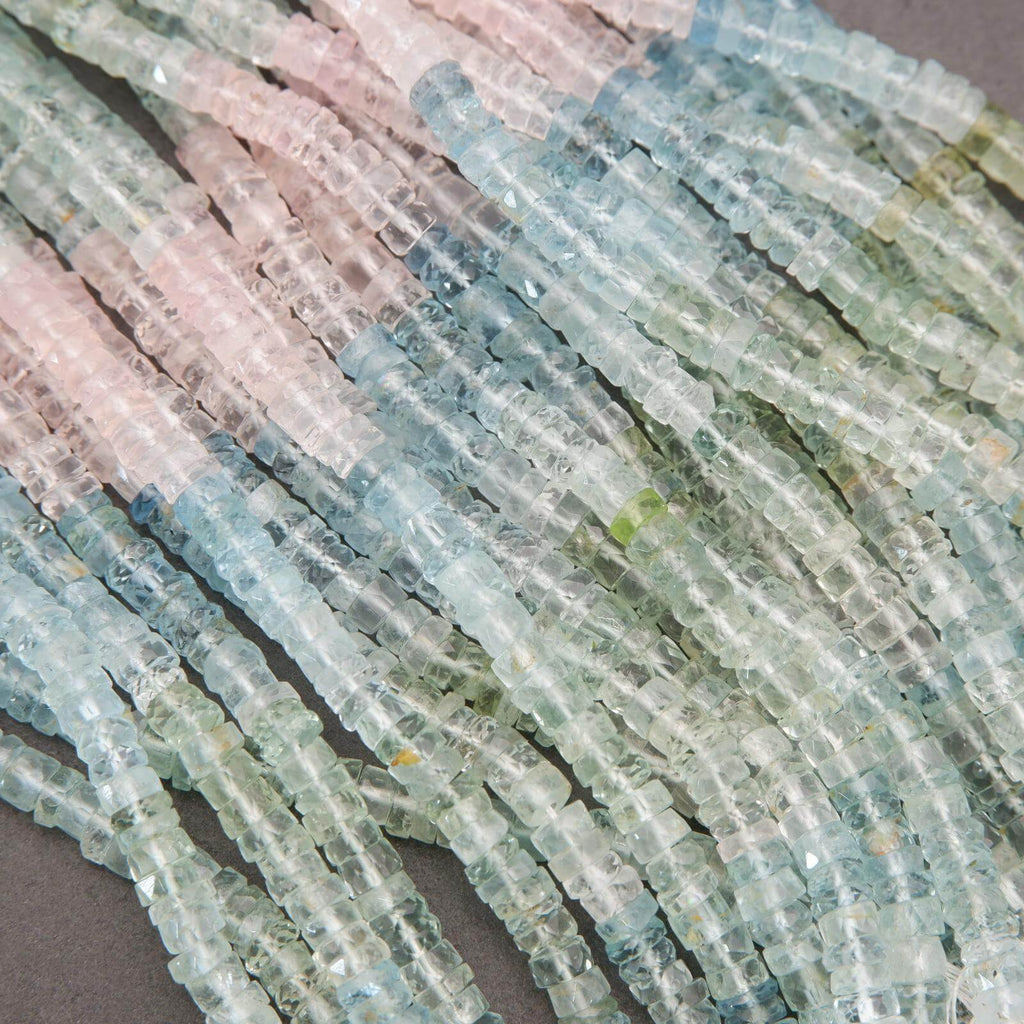 Close-up of multicolored beryl beads arranged in a pattern.