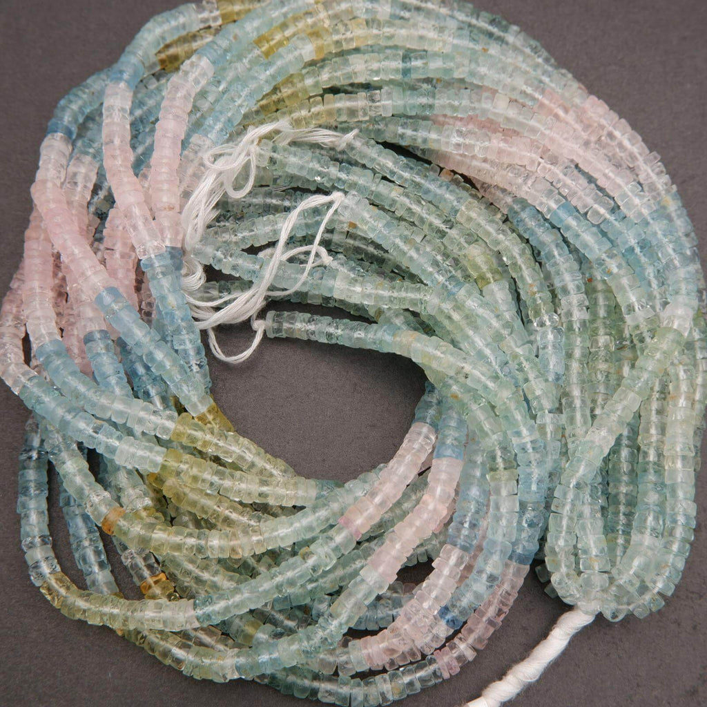 Close-up of multicolored beryl beads arranged in a pattern.