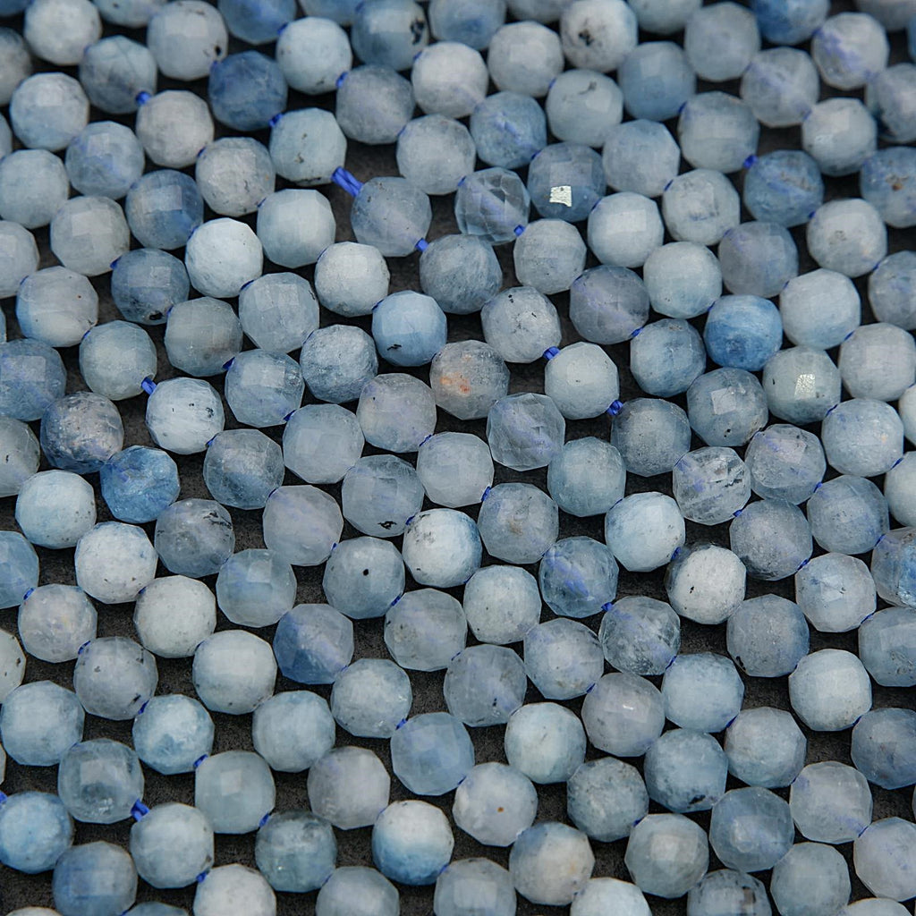 Pale blue aquamarine gemstone beads with organic texture