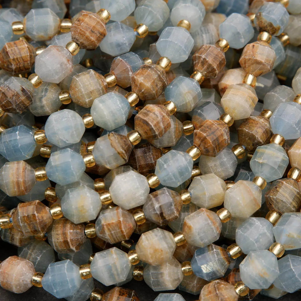 Close-up of multicolored beads with gold accents on a dark background