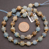 Beaded necklace with blue and brown beads on a gray background