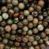 Close-up of green and brown marbled beads