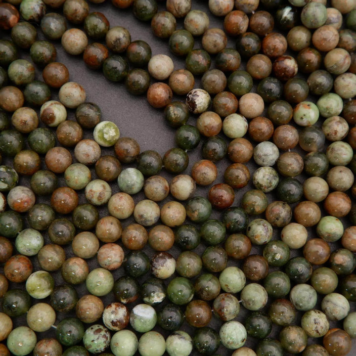 Close-up of multicolored beads on a dark background