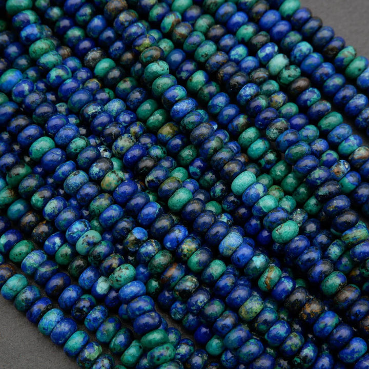 Blue and green azurite gemstone beads with mottled patterns and earthy matrix