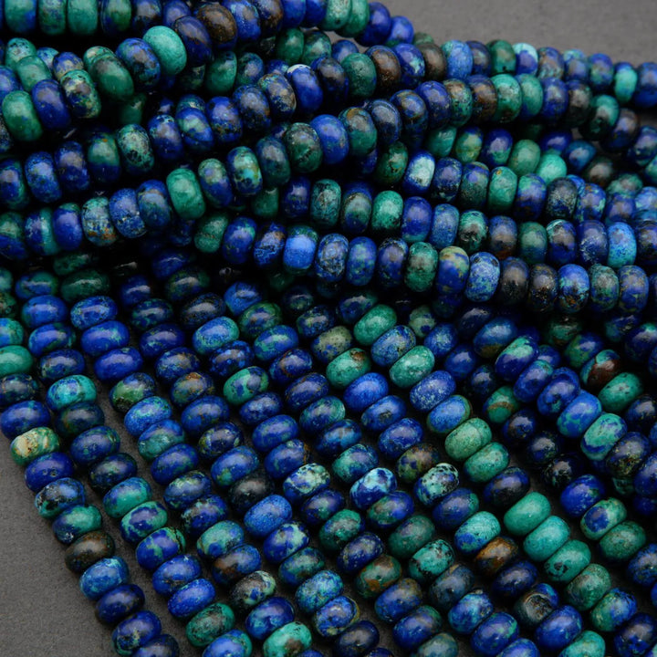 Polished azurite beads with natural malachite inclusions and dark matrix patterns