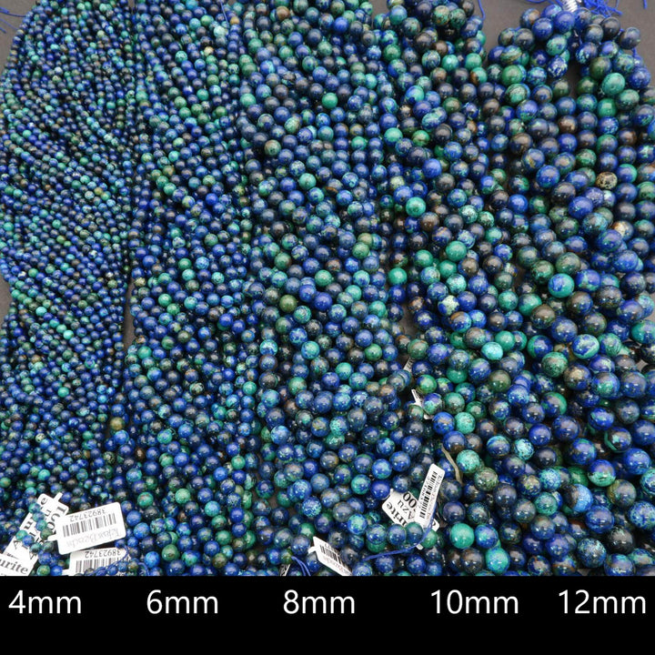 Blue and green beads with size measurement labels at the bottom