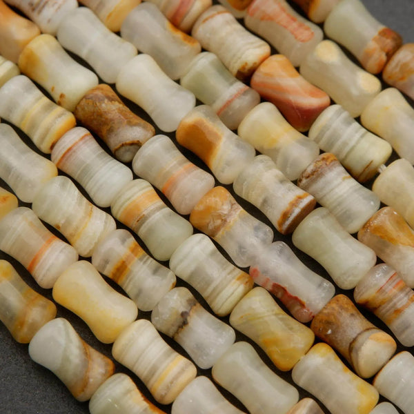Green and yellow calcite beads with natural banding and earthy tones