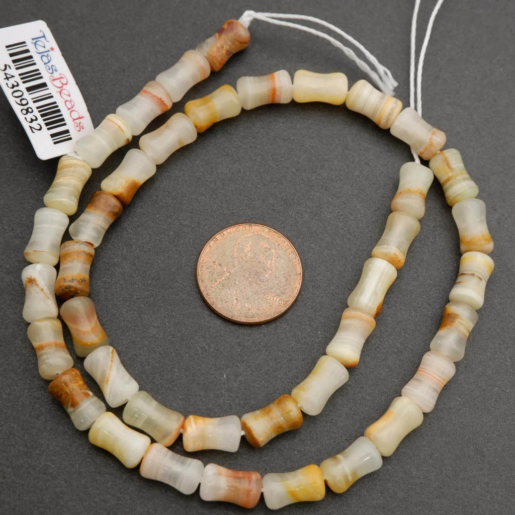 Striped calcite beads in pale green, beige, and golden tones for jewelry making
