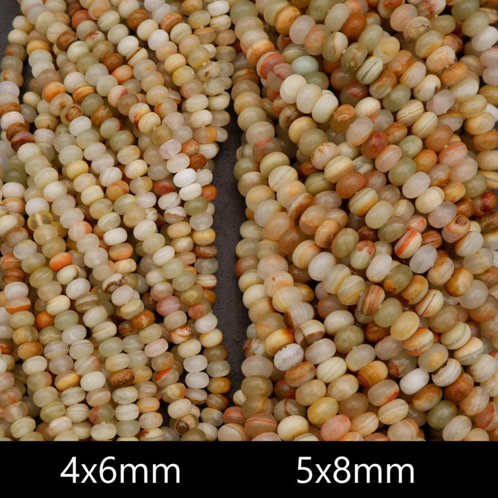 Green banded calcite gemstone beads with gentle translucence and natural horizontal banding.