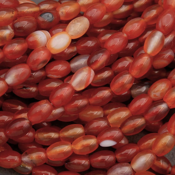 Close-up of red and orange marbled beads