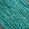 Close-up of turquoise beads on a dark background