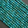Close-up of turquoise beads on a dark background