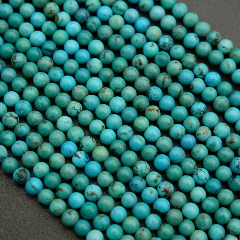 Close-up of turquoise beads on a dark background
