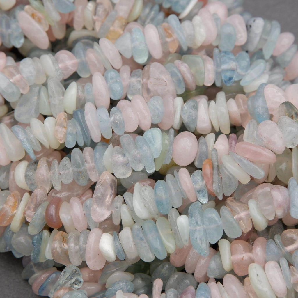 Close-up of multicolored stone beads on a gray background