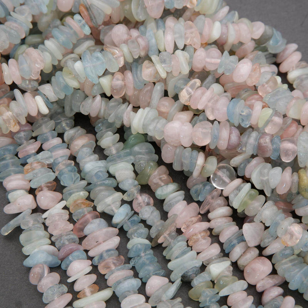 Close-up of multicolored stone beads on a gray background