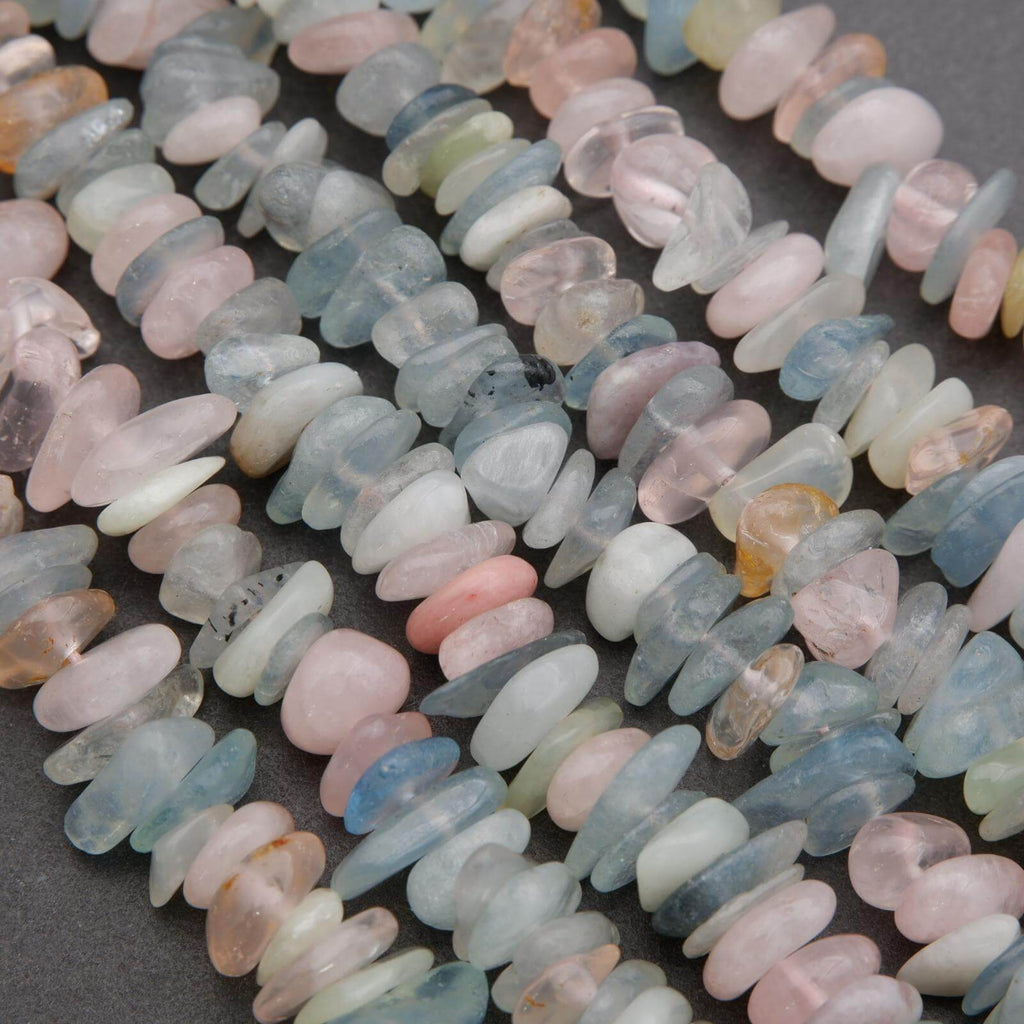 Close-up of multicolored stone beads on a dark surface