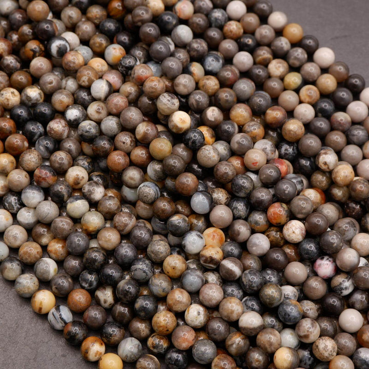 Close-up of multicolored round beads on a gray surface