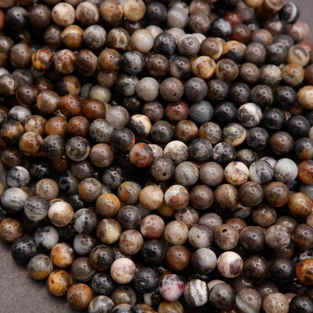 Close-up of multicolored round beads on a gray background