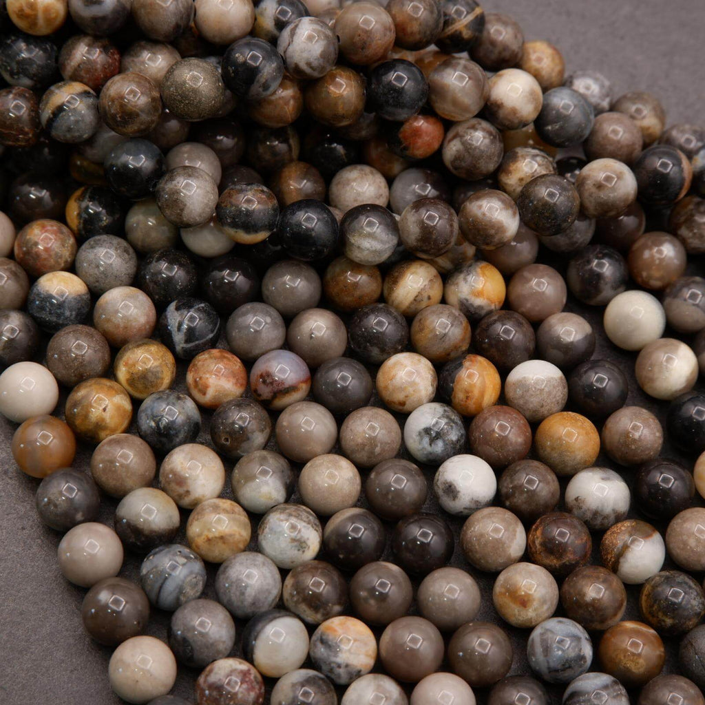 Close-up of multicolored round beads on a gray surface
