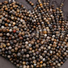 Close-up of multicolored beads on a dark background