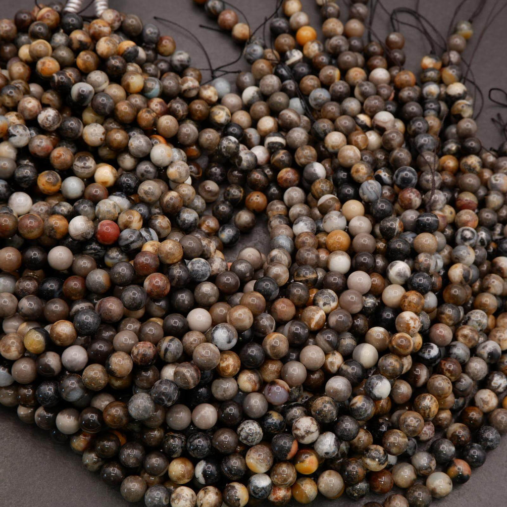 Close-up of multicolored beads on a dark background