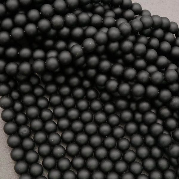 Close-up of black beads on a gray background