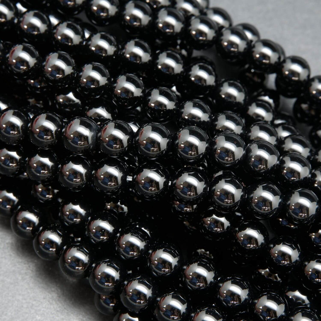 Polished round black onyx beads.