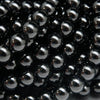 Polished round black onyx beads.