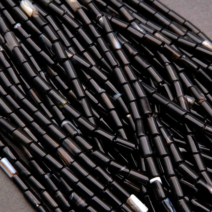 Close-up of black beads on a dark background