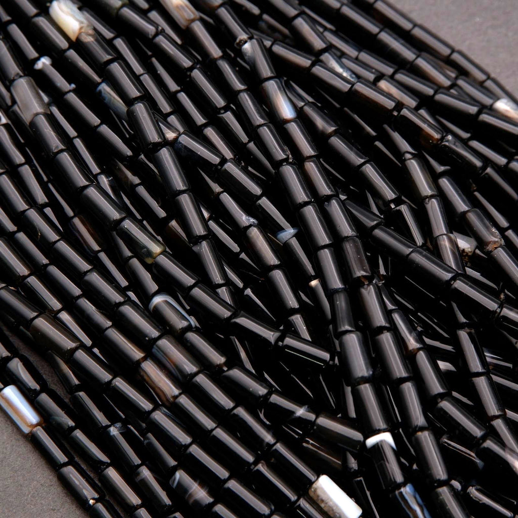 Close-up of black beads on a dark background