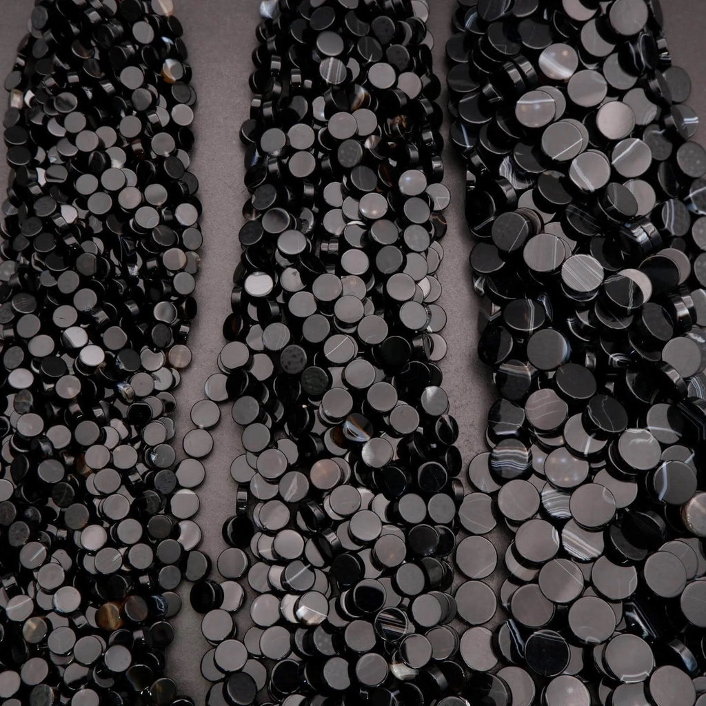 Close-up of black sequins on a gray background