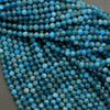 Faceted round blue beads.