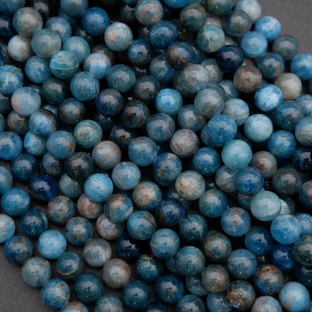 Close-up of blue and gray beads on a dark background