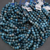String of blue beads with price tags on a gray background