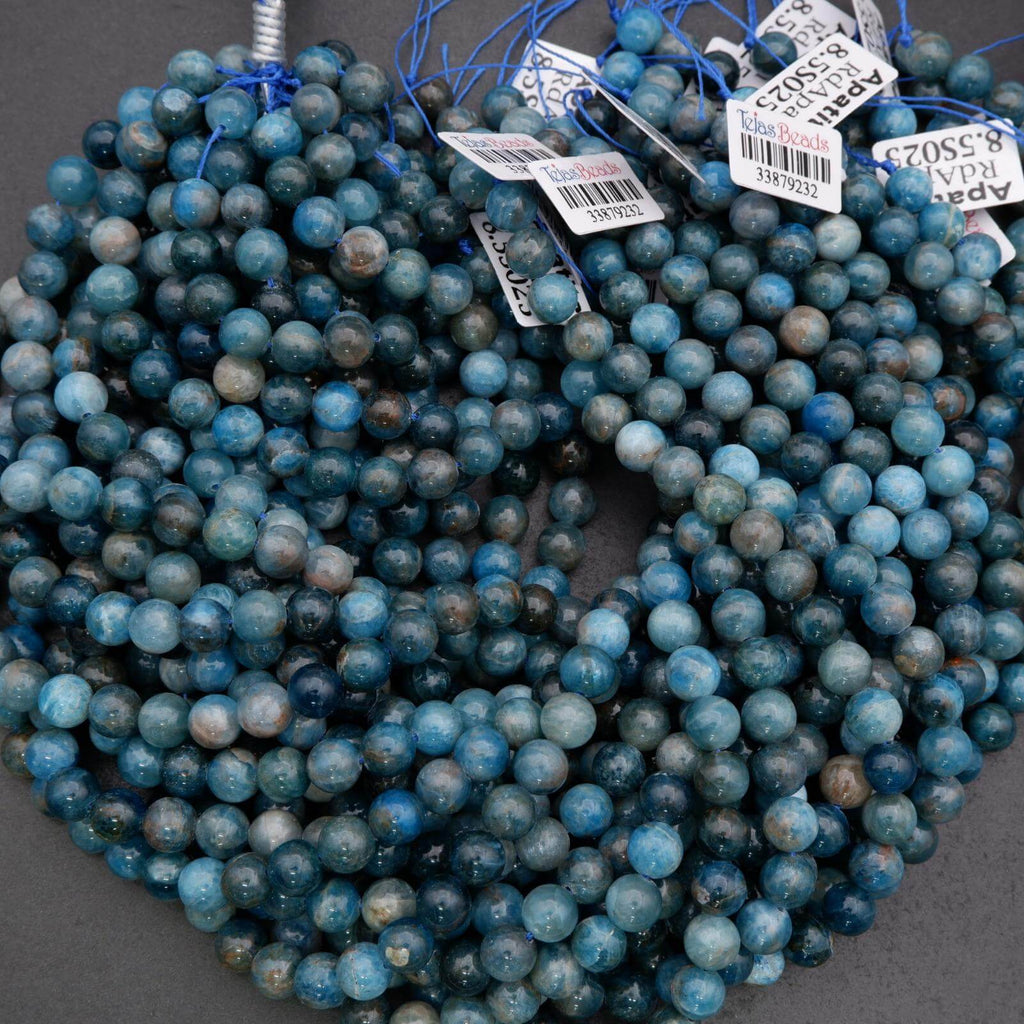 String of blue beads with price tags on a gray background