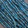 Close-up of blue faceted beads on a gray background