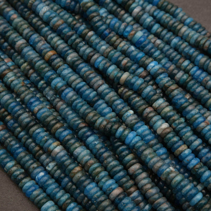 Close-up of blue beads on a gray background