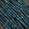 Close-up of blue beads on a gray background